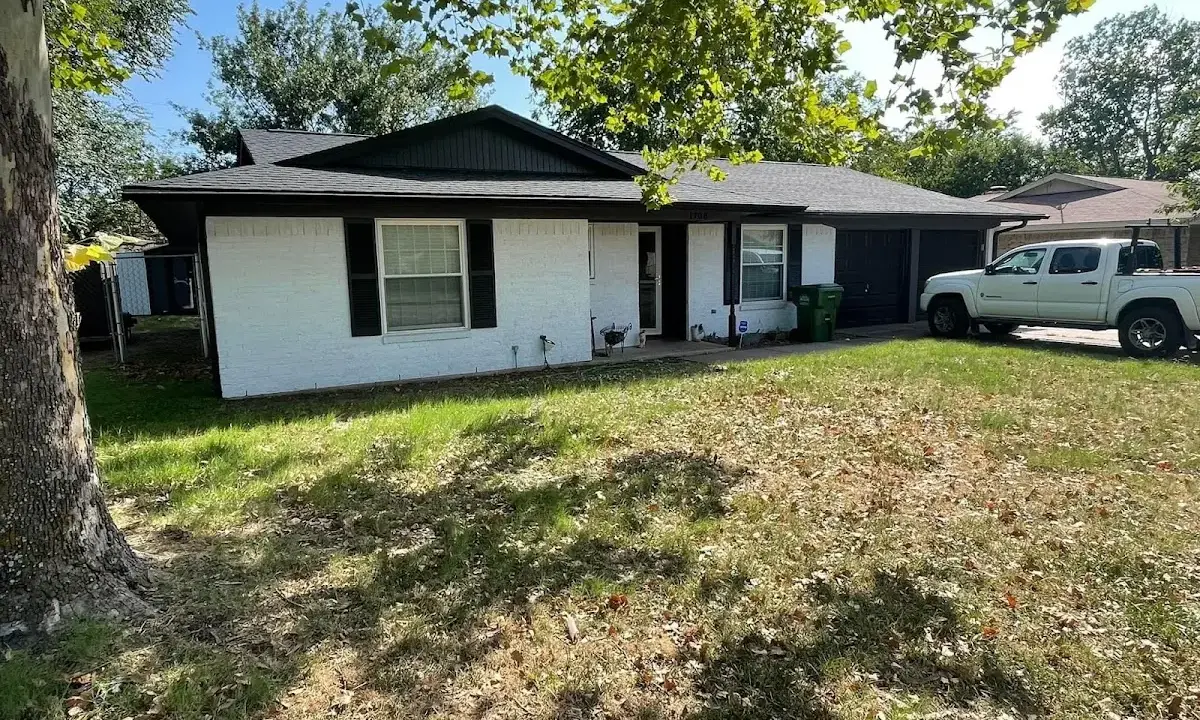 Professional roofing crew working on a residential roof in Nutley